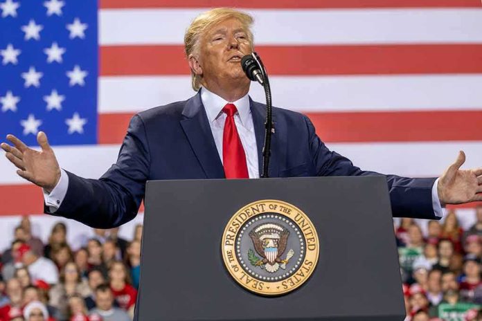speaker at podium with U.S. flag backdrop