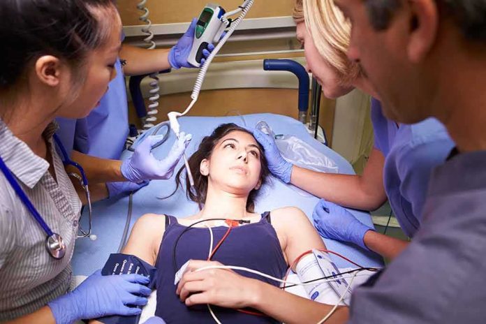 Patient on hospital gurney surrounded by medical staff