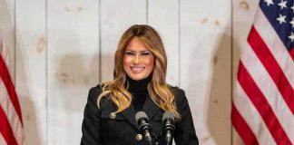 Putin Backchannel: Melania’s Quiet Win? woman speaking at podium with microphones and US flags