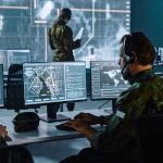 Iran Slaps Bounty On U.S. Troops Military analysts at computers in a command center