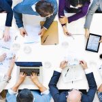 Group of professionals collaborating around a conference table