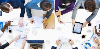 Group of professionals collaborating around a conference table