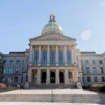 State capitol building with gold dome and columns