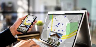 Antitrust Heat Scorches Zillow–Redfin Person using phone and laptop with real estate map app