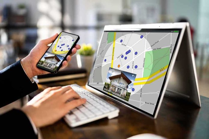 Person using phone and laptop with real estate map app