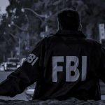 FBI Mole Trapped In Cartel Hell FBI agent in jacket facing a city street at dusk