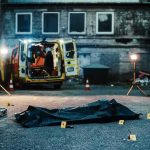 crime scene with body bag in alley