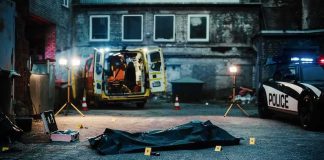 Back Shot Claim Rattles National Guard Story crime scene with body bag in alley