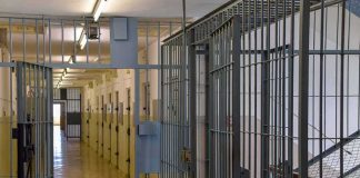Humanitarian Card Played — What’s Putin After? Prison corridor with barred doors
