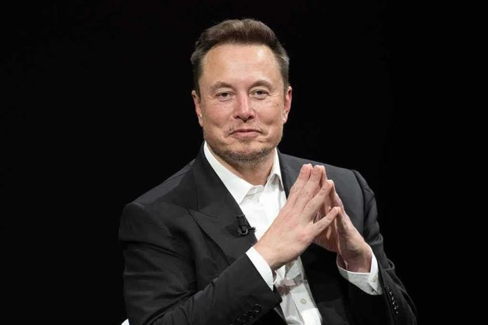 Man in a dark suit with hands clasped together