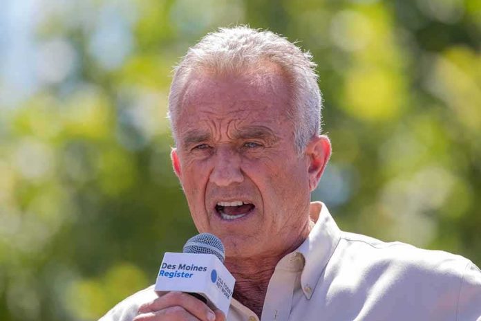 shutterstock_2346739545 man speaking into a microphone outdoors
