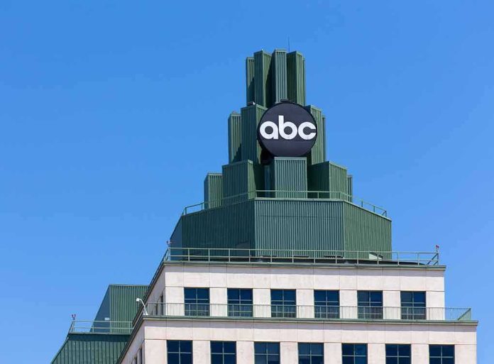 shutterstock_275394884 abc logo atop green-stepped building against clear blue sky