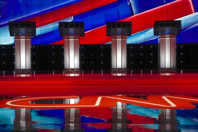 shutterstock_353120126 Debate stage with four empty podiums and bright red and blue backdrop
