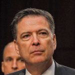 man in suit at a hearing