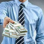 Paid To Quit? Washington’s $9.5B Stunner Person in business attire offering bundles of US dollar bills