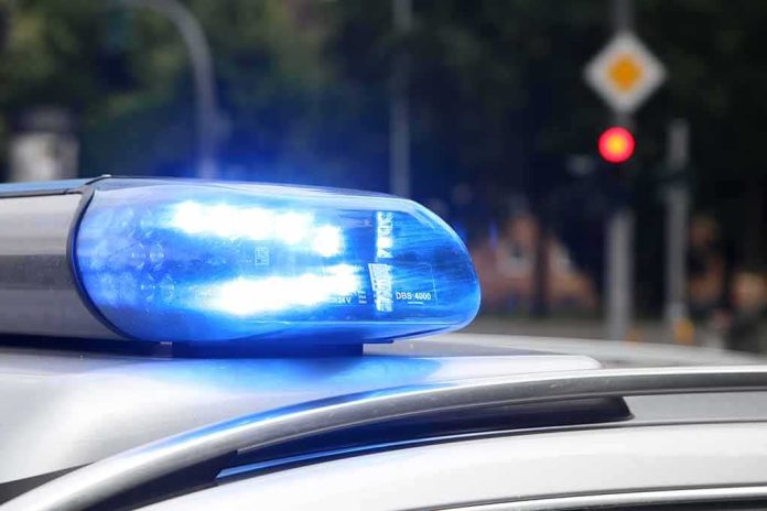 shutterstock_1008710953-1 Police car blue siren light flashing
