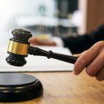 Narco Plot Or State Duty? Court On Edge Judge's hand holding a gavel over a sound block