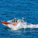 Black Hawk Helicopter Gunfire Halts Smugglers coast guard patrol boat speeding across open ocean