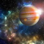 Jupiter in a colorful star field with bright lens flares