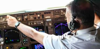 Miracle Pilot’s Stark Diagnosis Stuns Pilot adjusting controls in an airplane cockpit