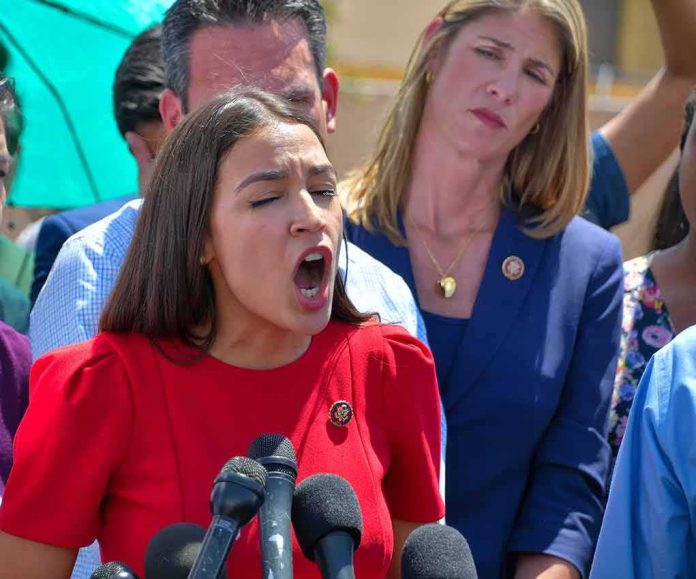 woman in red speaking passionately at microphones