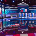 RUBIO SURGES: Threat to Vance’s MAGA Crown? Televised debate stage with multiple podiums and bright red, white, and blue lighting