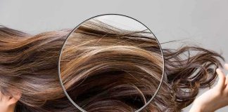 Magnifying glass highlighting long brown hair