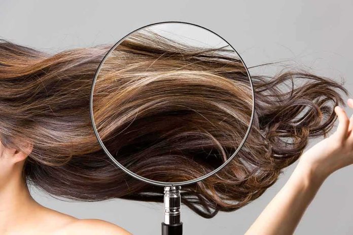 shutterstock_1743835547 Magnifying glass highlighting long brown hair