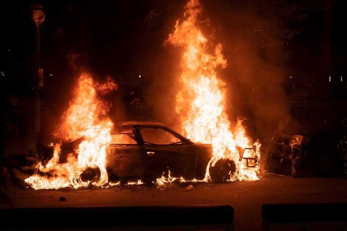 shutterstock_1744512746 Burning car engulfed in flames at night