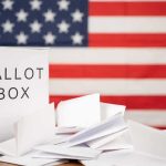Primary Earthquake: Democrat Bows Out Ballot box with papers in front of an American flag