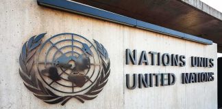 United Nations emblem and signage on a concrete wall