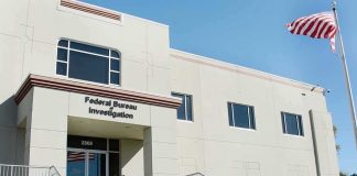 FBI office building with entrance steps and American flag