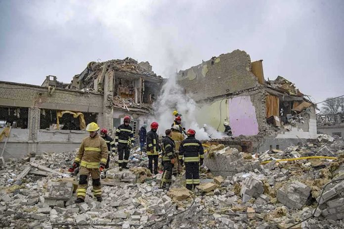 Firefighters search rubble of a partially collapsed building
