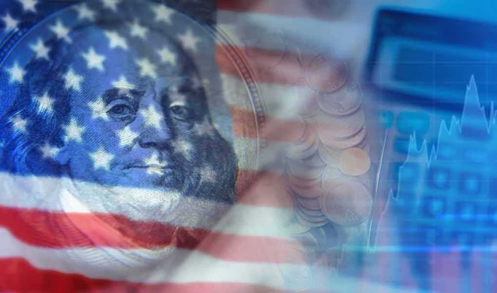 shutterstock_2149460989 American flag overlay on US currency and financial chart