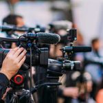Trump Win: Tacoma Jobs Boomerang Home Video cameras on tripods at a media event