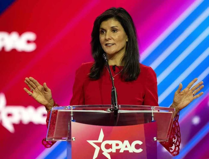 Nikki Haley speaks at a podium with a colorful backdrop