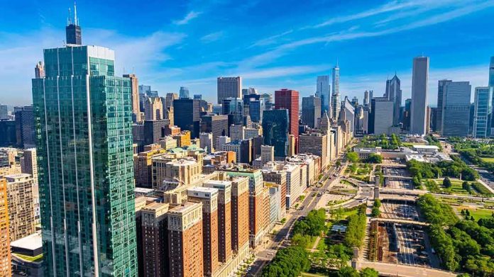 shutterstock_2525953849 City skyline with tall glass skyscrapers and urban park