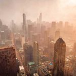 NYC Rent War Explodes Again City skyline in warm haze at sunset
