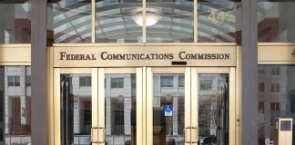 Federal Communications Commission building entrance with gold doors
