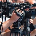 JD Vance Draws Line—No Cash Without Proof television cameras on tripods at a media event