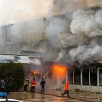 Mass-Casualty Pub Fire Stuns Thailand firefighters respond to large building fire with heavy smoke