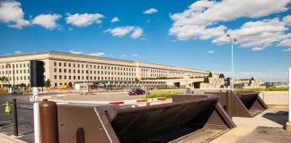 DOJ Nails ISIS-K Operative – Big Questions Linger security barriers at a government building entrance