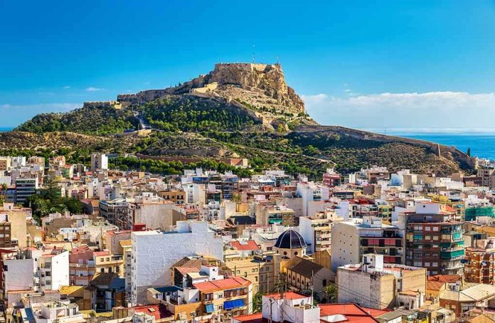 shutterstock_529989631 Hilltop fortress overlooking a coastal city