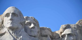 Mount Rushmore granite sculptures against a clear blue sky