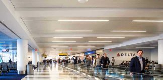 Airport Chaos: Selma Blair Detained, Injuries Alleged Airport terminal with passengers on a moving walkway
