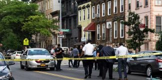 Gunshots, Sirens, Confusion: ICE Raid Turns Ugly Police gathered at an urban crime scene.