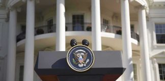 Five-Day Firing Shocks White House Presidential podium with seal in front of white-columned building