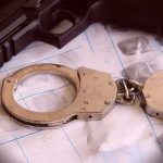 Grandma Kingpin? Senator’s Wild Pot Ring Handcuffs on fingerprint sheets beside a handgun