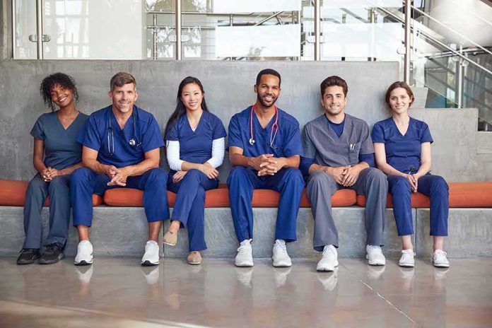 Group of medical professionals sitting on a bench