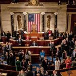 Leonard Lance and Claude Guéant among lawmakers on a legislative chamber floor